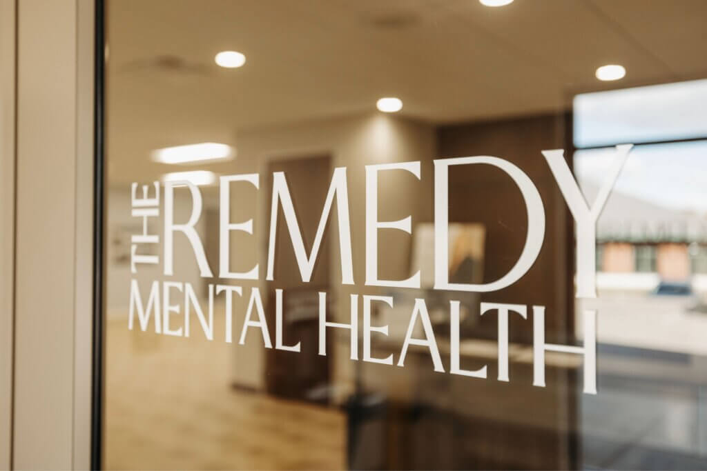 The Remedy Mental Health logo displayed on a clinic window