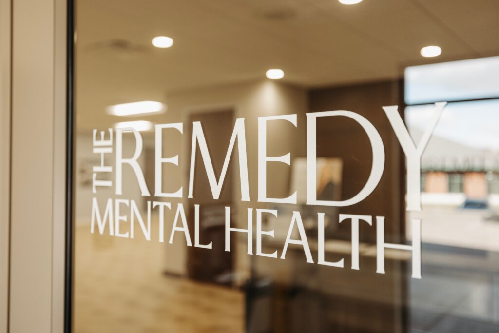 The Remedy Mental Health logo displayed on a clinic window