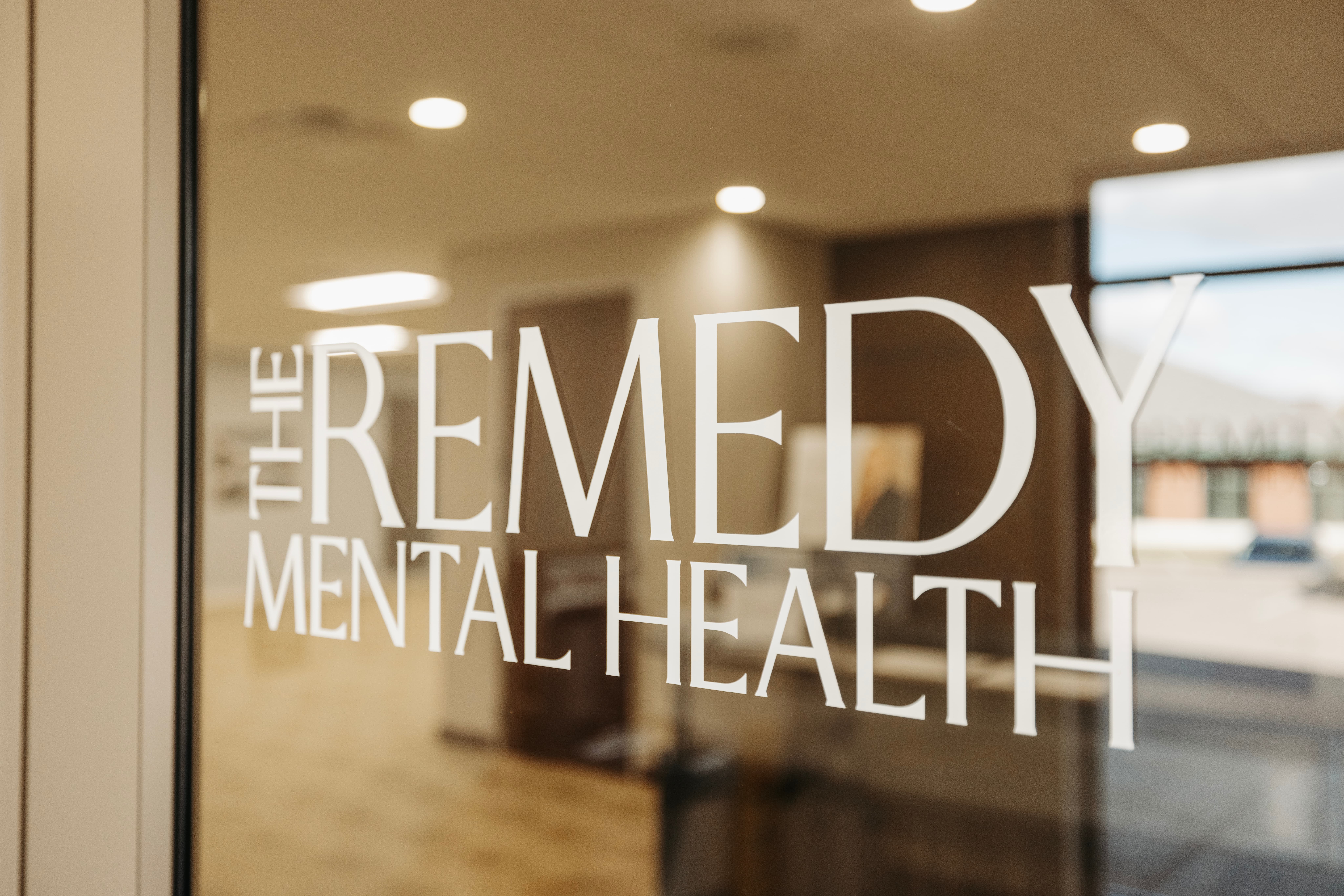The Remedy Mental Health logo displayed on a clinic window