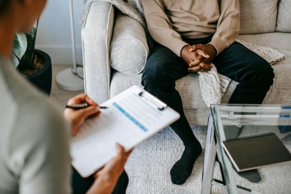Patient meeting with a mental health provider during an in-person appointment